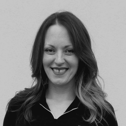 Portrait of Talia Tschida, a professional stylist at Yacht Club Salon, showcasing their expertise and style.