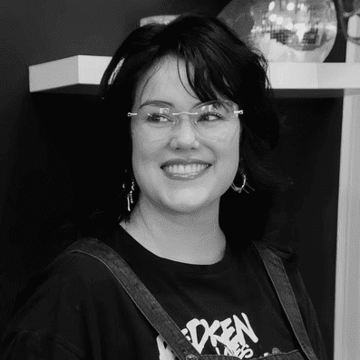 Portrait of Kaeleigh Tran, a professional stylist at Yacht Club Salon, showcasing their expertise and style.