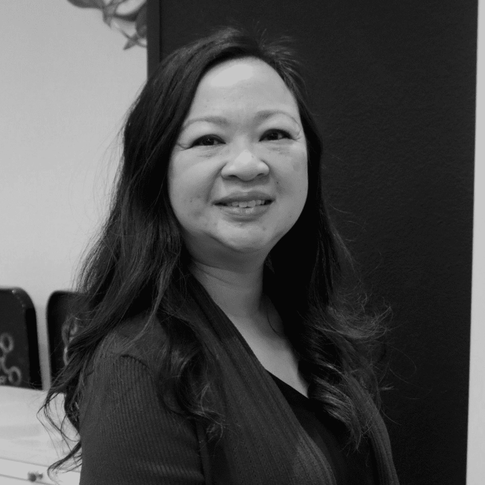 Portrait of Karen Pham, a professional stylist at Yacht Club Salon, showcasing their expertise and style.
