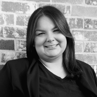 Portrait of Breanna Harte, a professional stylist at Yacht Club Salon, showcasing their expertise and style.