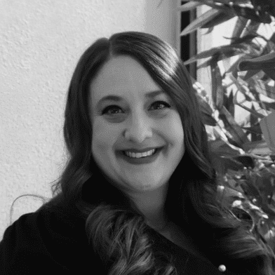 Portrait of Jamie Theisen, a professional stylist at Yacht Club Salon, showcasing their expertise and style.