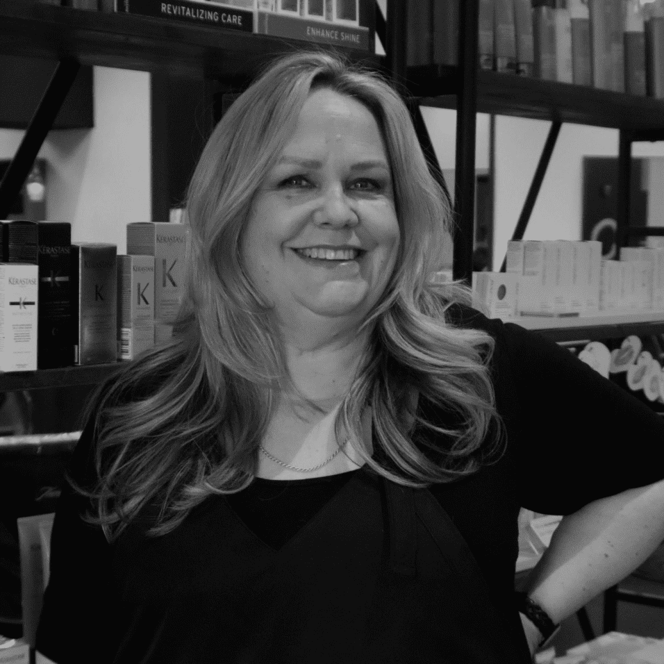 Portrait of Deana Faust, a professional stylist at Yacht Club Salon, showcasing their expertise and style.